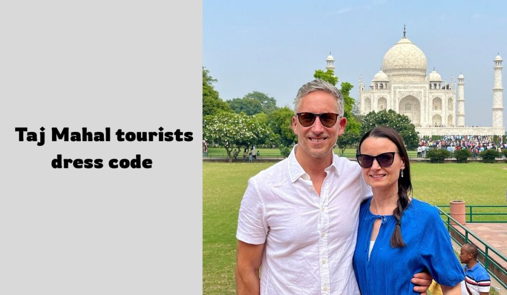 Foreign tourists wearing appropriate Taj Mahal dress code outfits posing near monument
