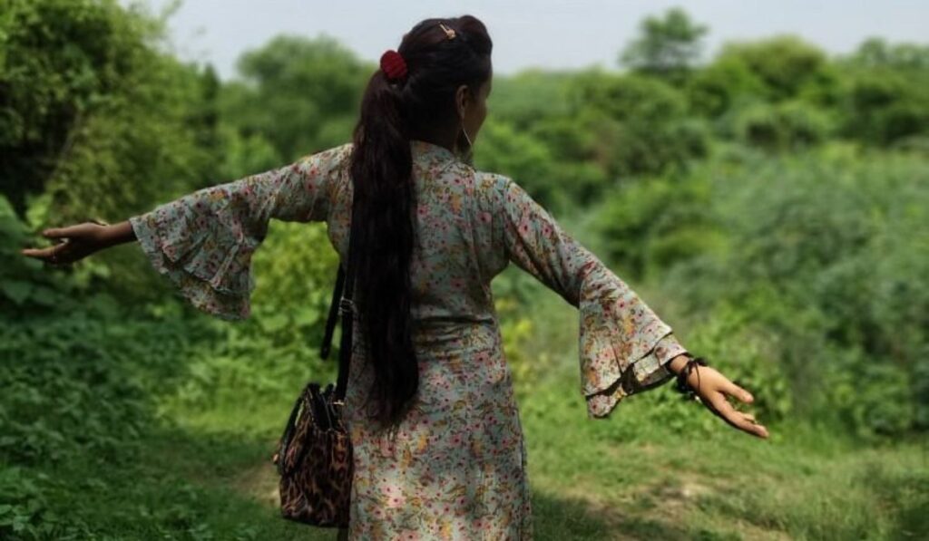 Traveler enjoying peaceful greenery and walking trails at Taj Nature Walk in Agra