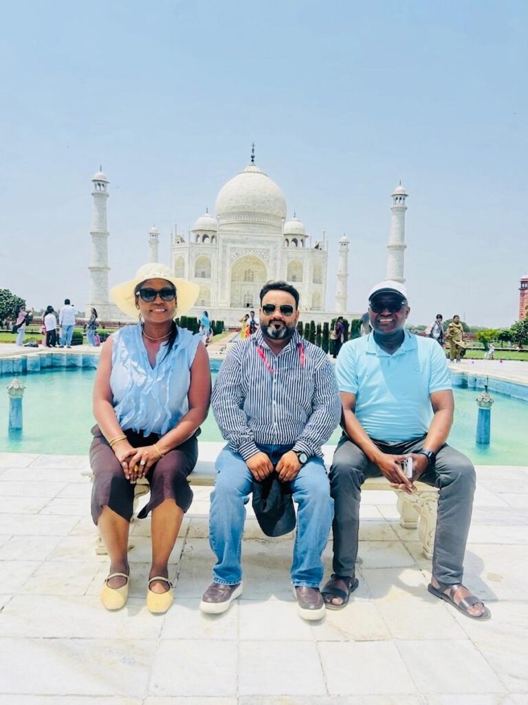 Government approved tour guide in Agra with international tourists at the Taj Mahal