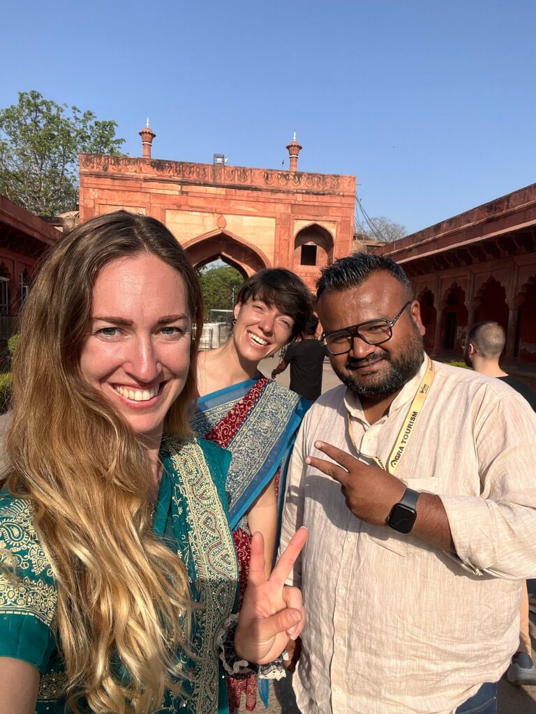 Licensed tour guide with international tourists during a guided tour at Agra Fort in Agra