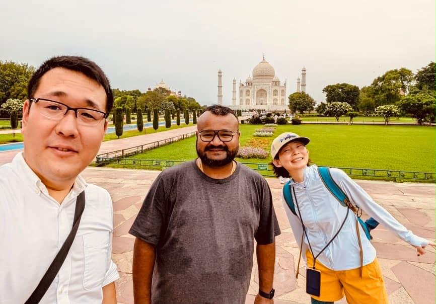 Mohd. Imran Khan with travelers visiting the Taj Mahal during a private tour in Agra